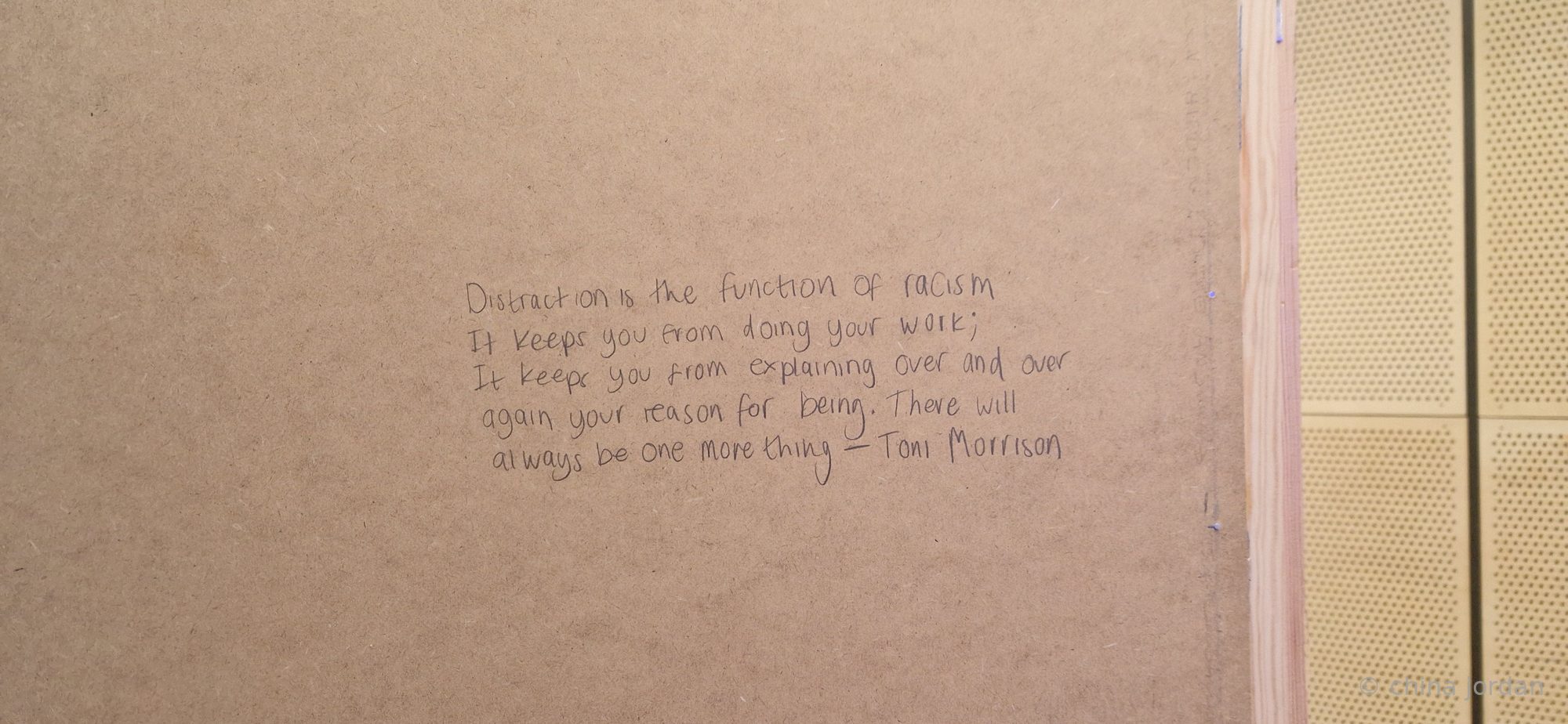 Pencil inscription — Toni Morrison quote on racism and distraction