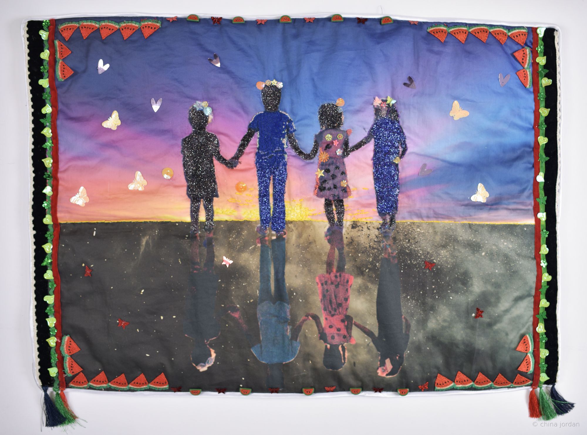 Care — quilted textile of children at sunset with watermelon and butterfly appliqu&eacute;s