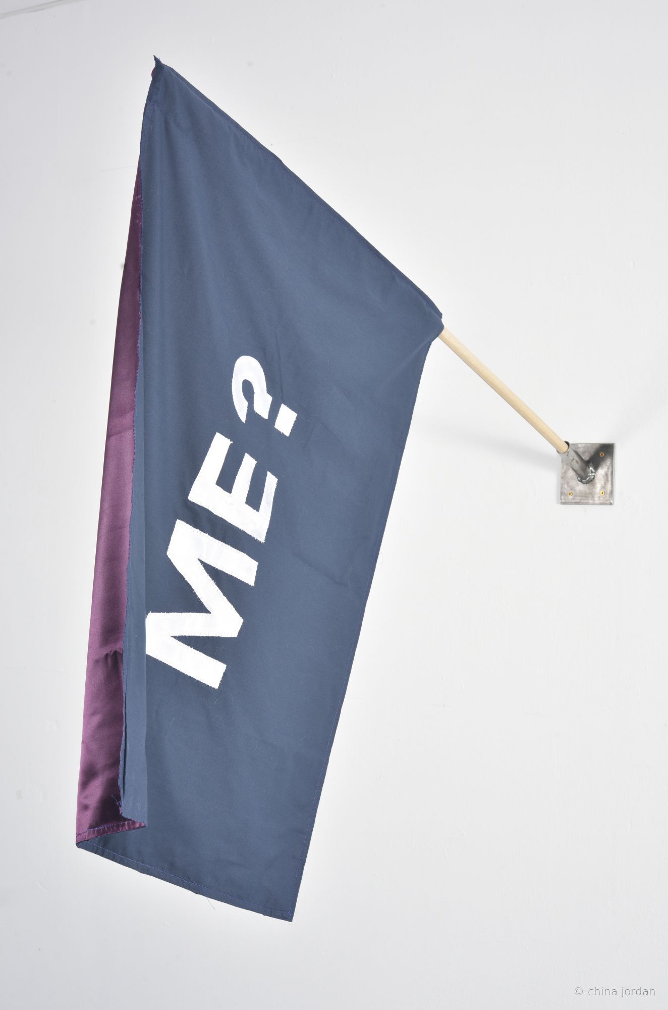 ME? — appliqu&eacute;d navy fabric flag on wooden pole